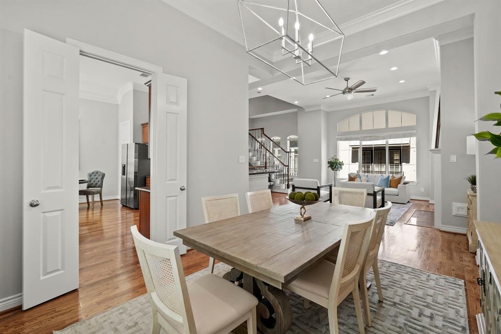 The spacious dining room overlooks the living room and has a passage to the kitchen