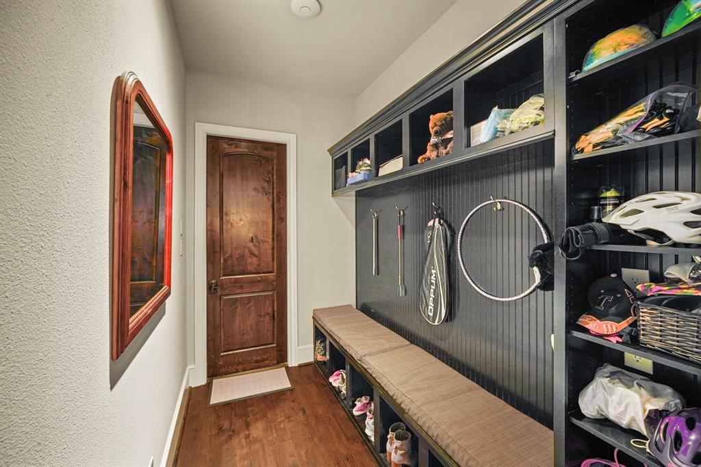 Mudroom off the garage with bench and storage cubbies for all your shoes activity gear!