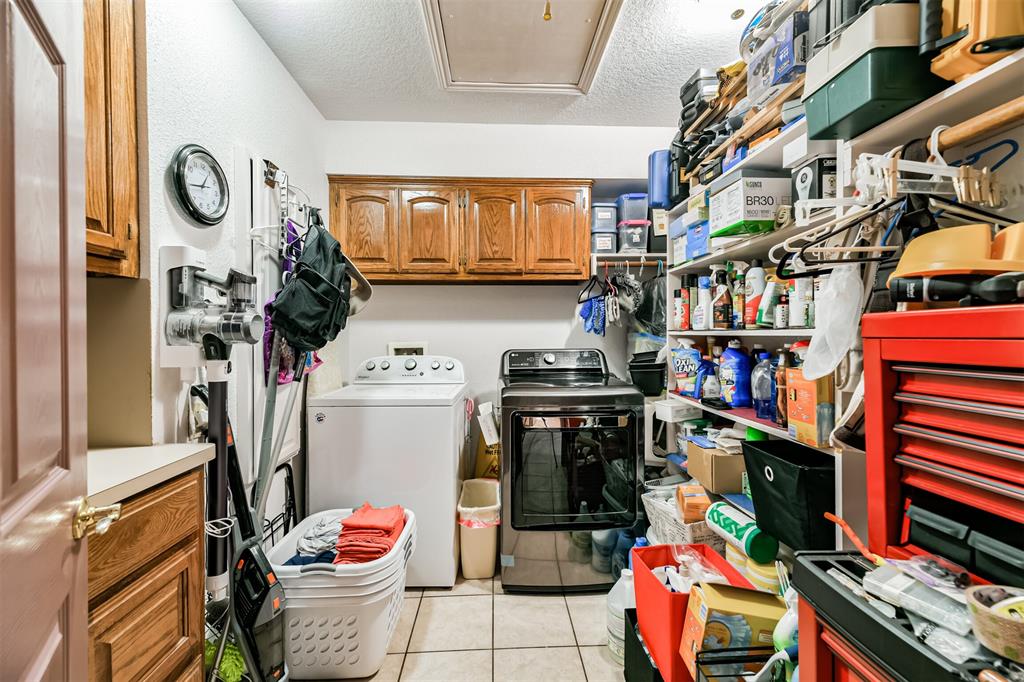 Over sized laundry room with sink