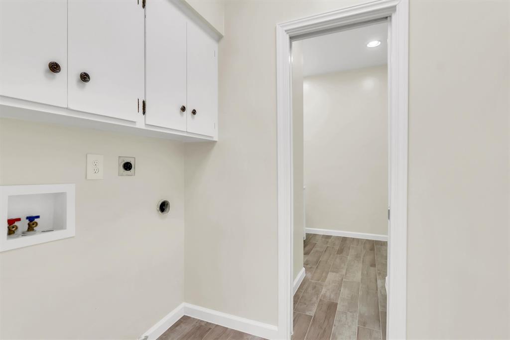 Laundry room next to kitchen.