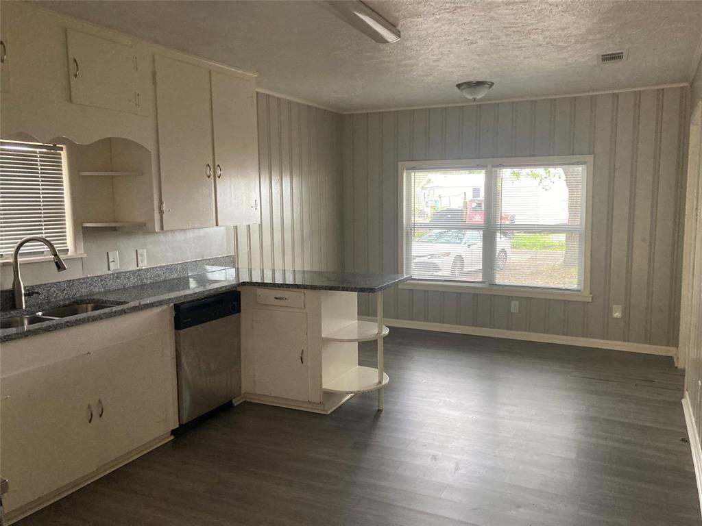 Kitchen opens to dining area