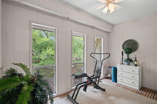 Enclosed balcony room overlooks greenspace