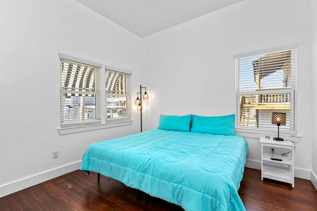 This second bedroom has original hardwood floors and access to the bathroom!