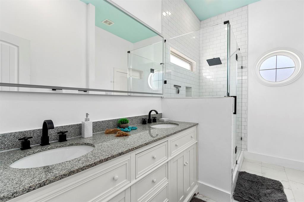 Wow! This fully updated bath has double sinks, LED fog-free mirror, granite countertops! Glass surround shower! Portal window! Tons of space!