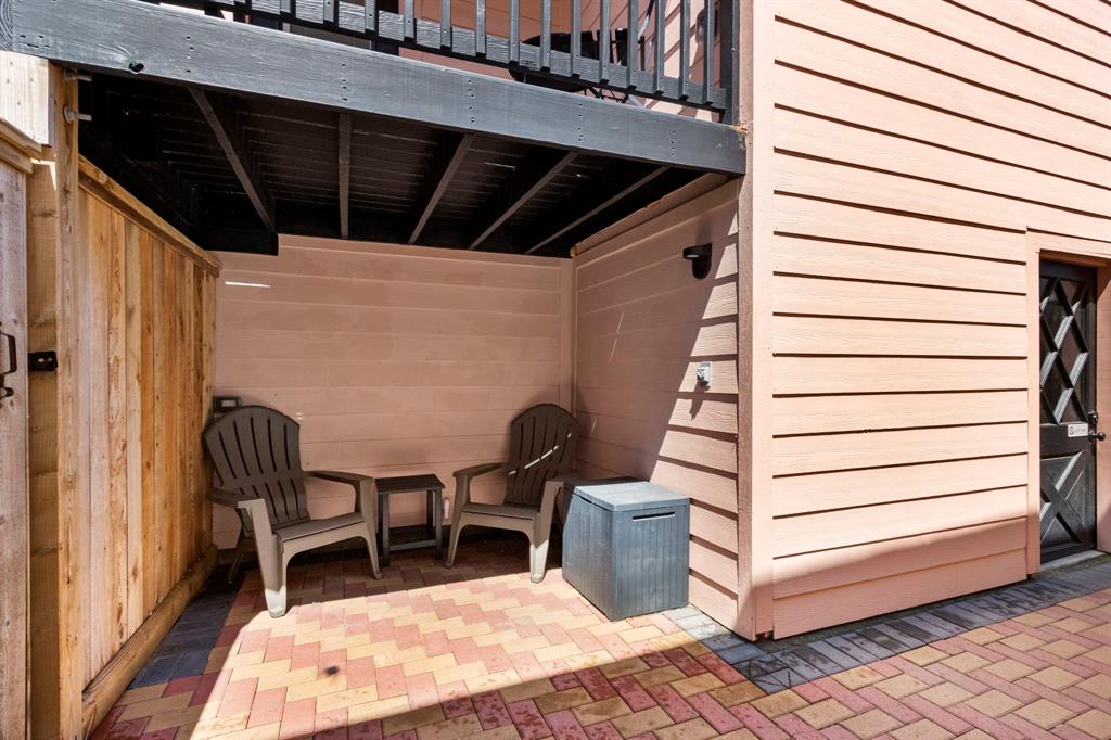 Hang out while the kids swim in the HOT TUB! The door on the right takes you to the full size washer and dryer and HUGE downstairs storage room for BEACH GEAR or build out for a game room or bunk room! Endless possibilities!