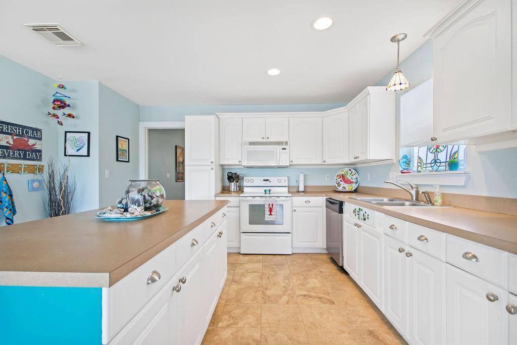 Galley style kitchen with plenty of storage and conveniences.