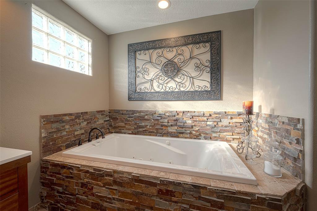 Stone detailing and tile flooring add a touch of elegance and sophistication.