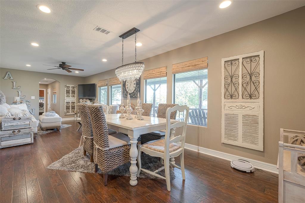 The open floor plan to the living room creates a sense of spaciousness, while the large windows let in plenty of natural light.