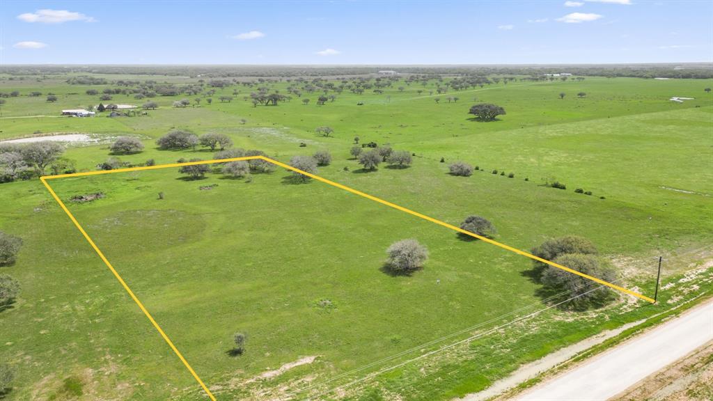 Front view of this gorgeous, 5 acre lot with Oak trees dotted along the property lines. *Border lines are not exact.