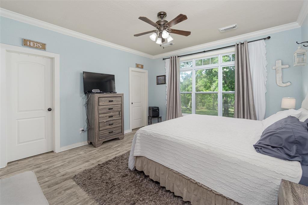 Primary bedroom, separate double walk-in closets