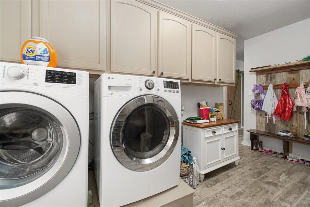 Laundry room with a ton of overhead storage!