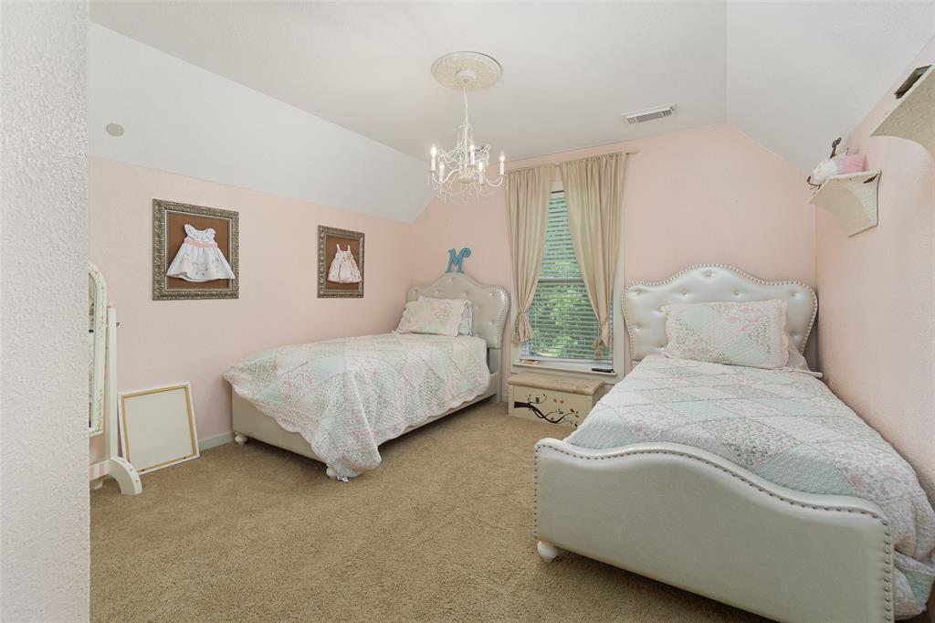 Third bedroom with adorable chandelier