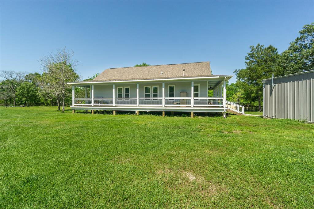 Second home located on the 3 acres of land! Beautiful wrap around covered porch