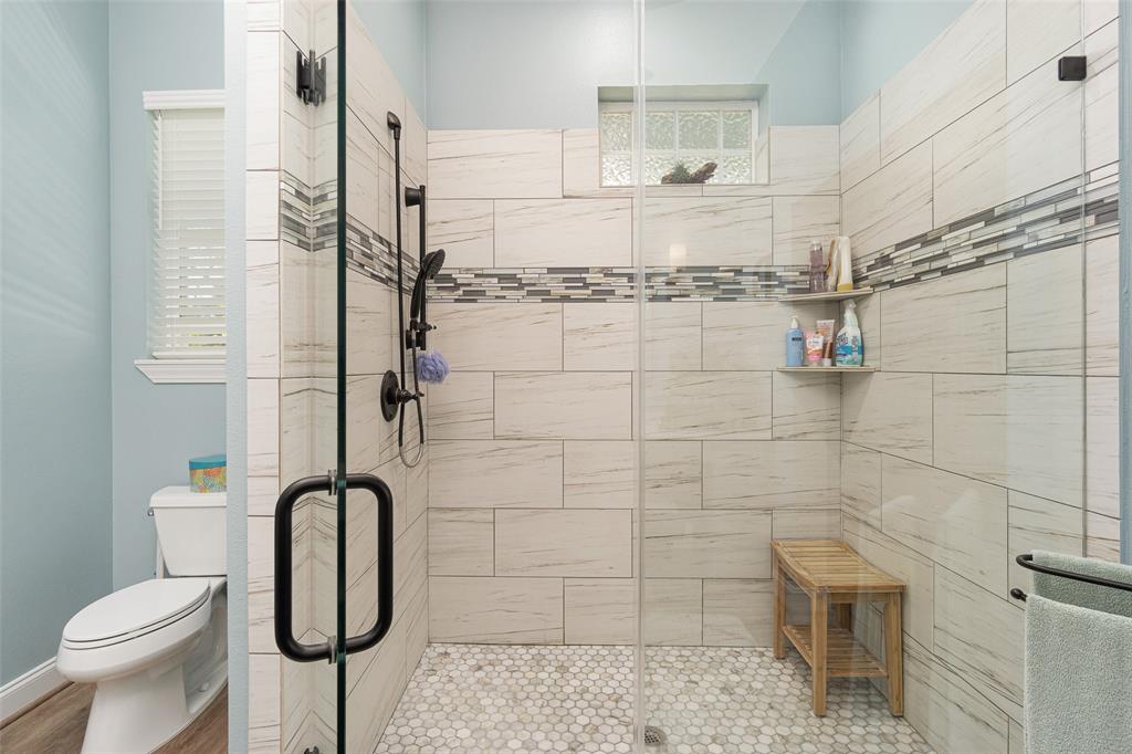 Fully tiled walk in shower in the primary en suite