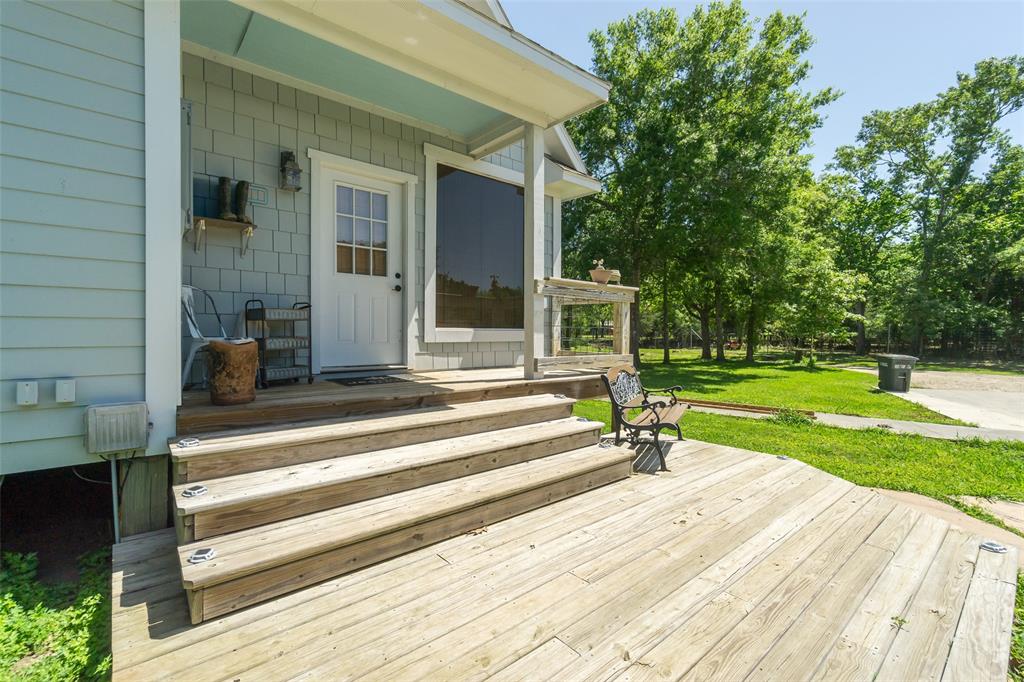 Covered back porch leading into the home