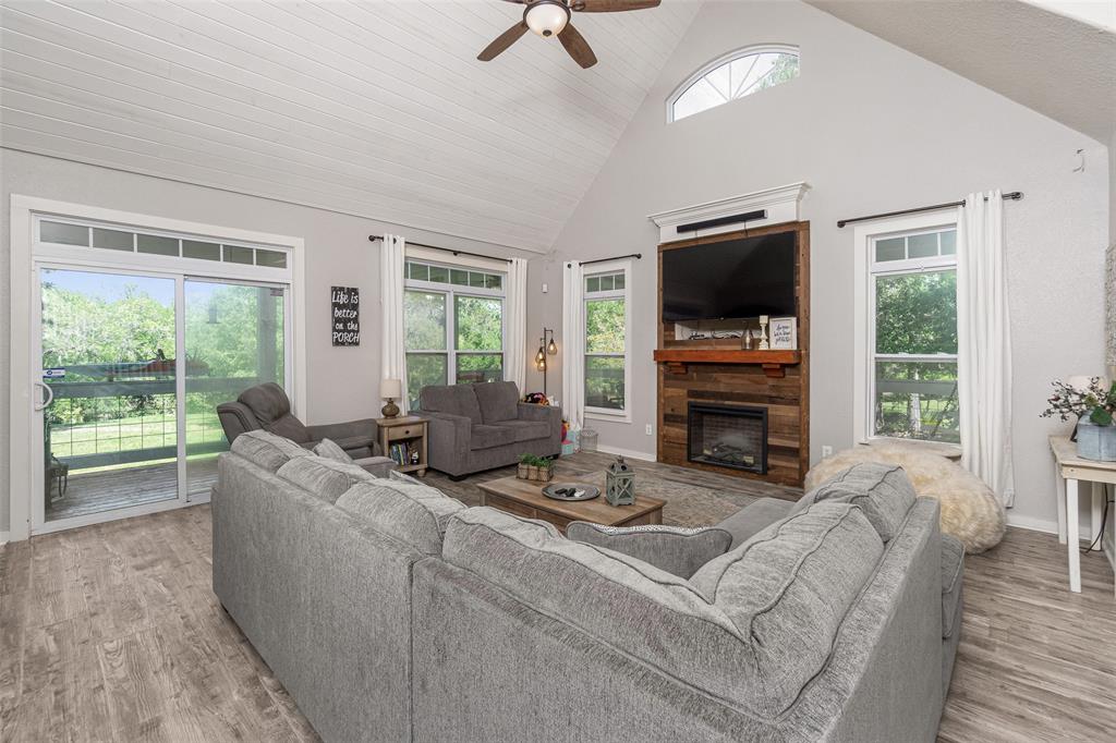 Spacious living room with a wall of windows for a picturesque view of the great outdoors!