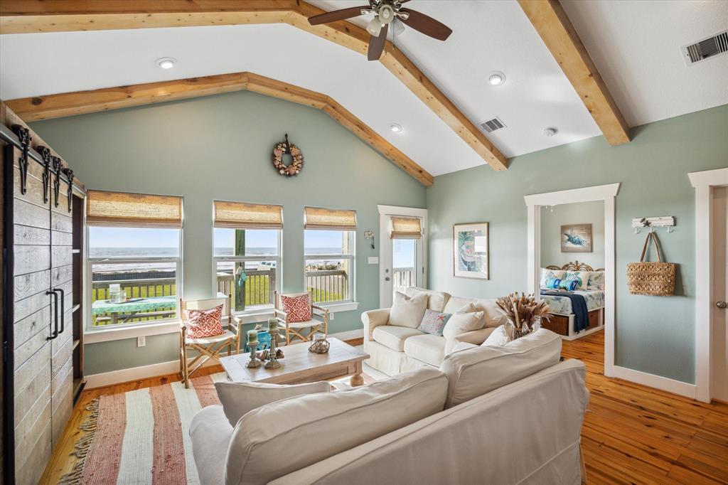 Spacious Living Area with designer shades and beautiful beams