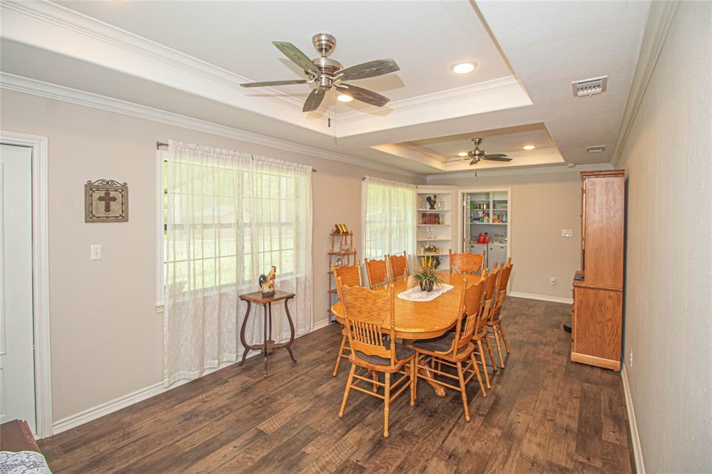 DINING ROOM WITH BACK DOOR LEADING TO COVERED PORCH