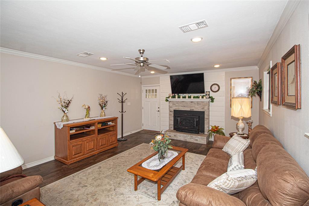 LIVING ROOM WITH WOOD BURNING FIREPLACE