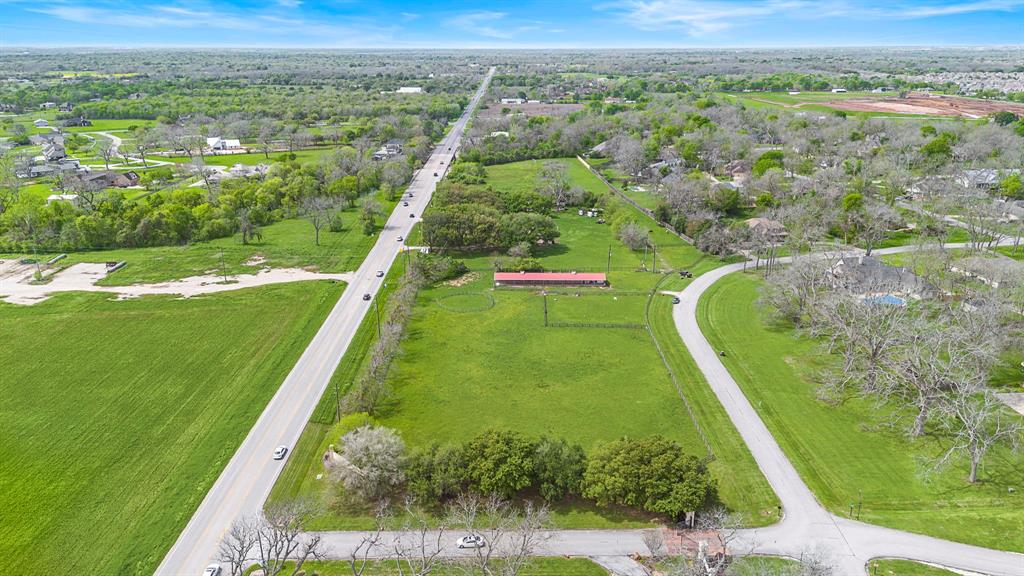 4.287 fully fenced acres with FM 359 frontage.  This beautiful equestrian property sits at the front of the stunning Texana Plantation entrance.  This property boasts a fenced arena and an 8 stall barn that includes tack rooms, washroom, wash rack and run outs for every stall.  Electric and Water already present.
