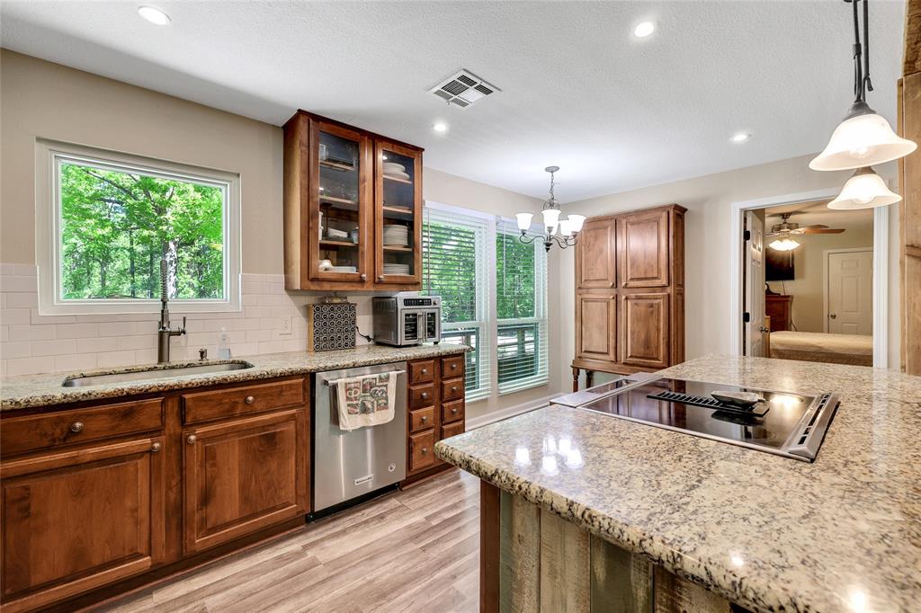 Kitchen features granite, stainless steel appliances, great cabinets and natural lighting