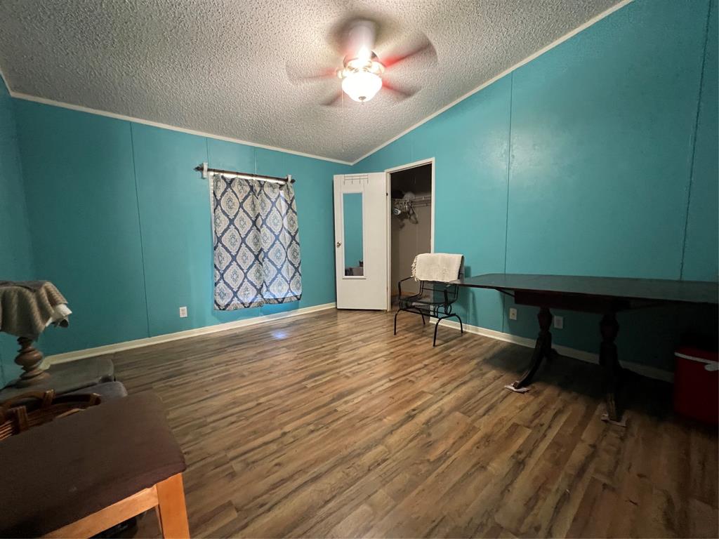 View showing part of dining, closet between dining and living room, part of living room.