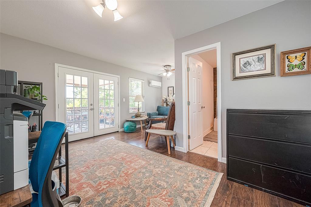 Upstairs gameroom / study/ bedroom. Has barndoor to close off and french doors leading out to balcony, as well as a full bathroom.