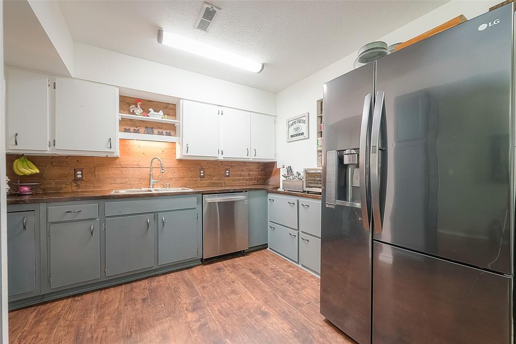 Open kitchen, stainless steel appliances, wood countertops recently resealed