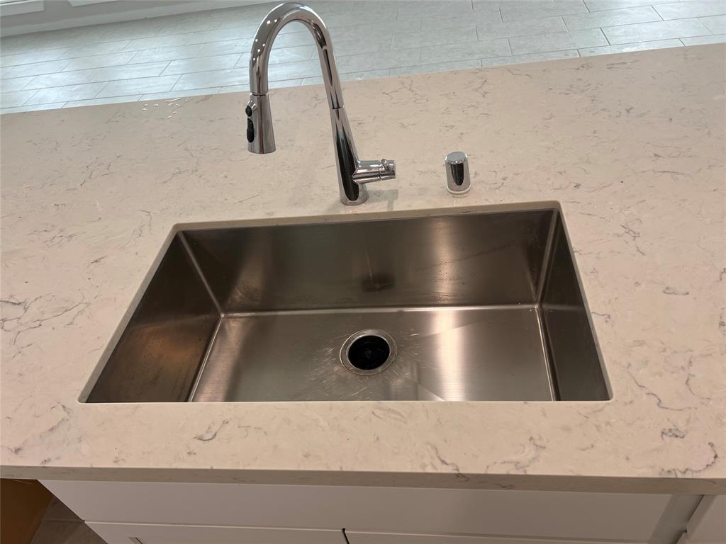 Undermount kitchen sink on the island.