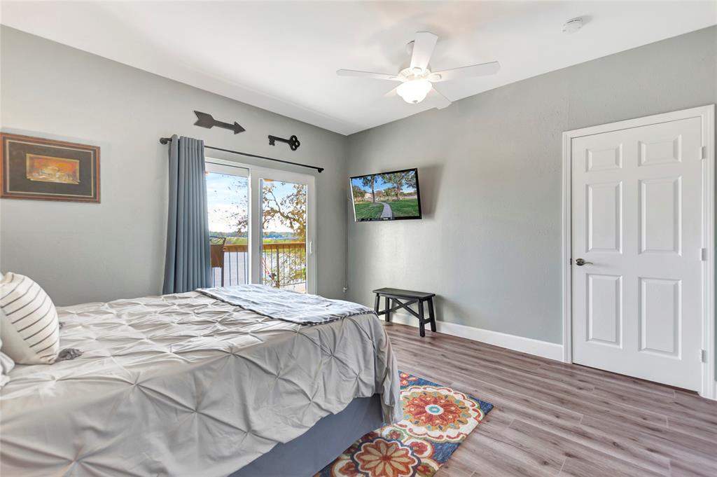 Tons of natural light also cascades in the Second Bedroom through the Large Access Triple Pane Hurricane Glass Balcony Doors.