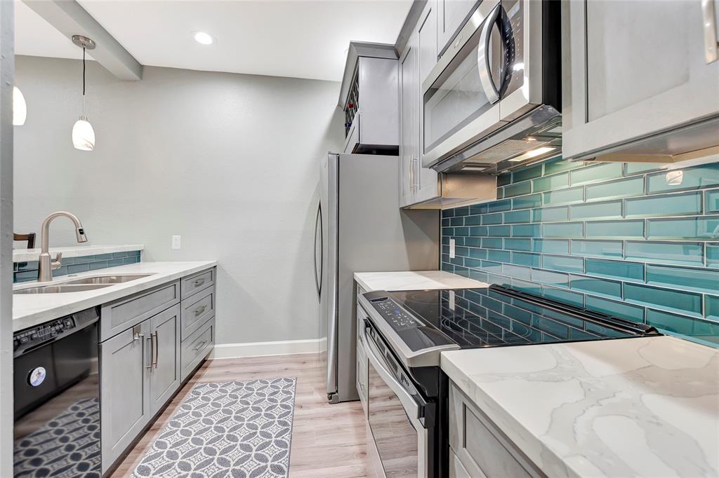 Guest Bathroom with Quartz Countertops, Porcelain Tile, and Pebble Stone in the Shower!