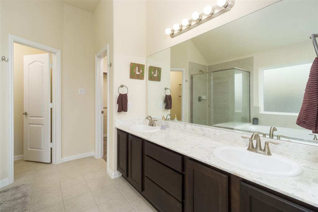 Primary en suite featuring double sinks and added counter space