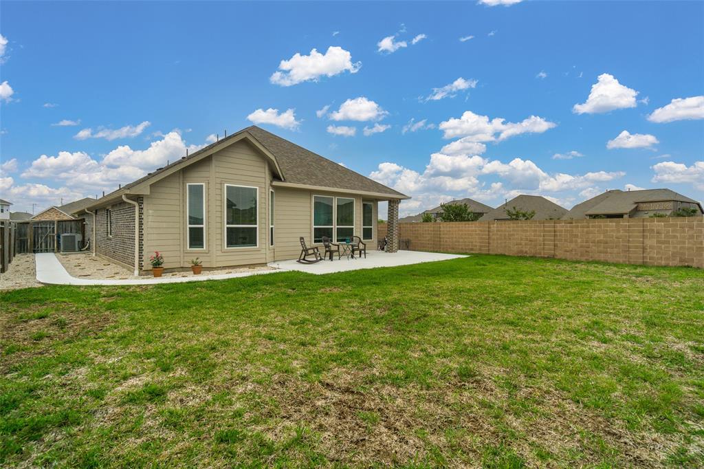 Back yard space, walk way from the front of the home