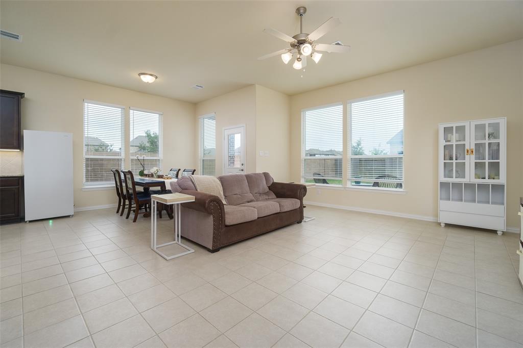 Large living space, lots of windows letting in a ton of natural light