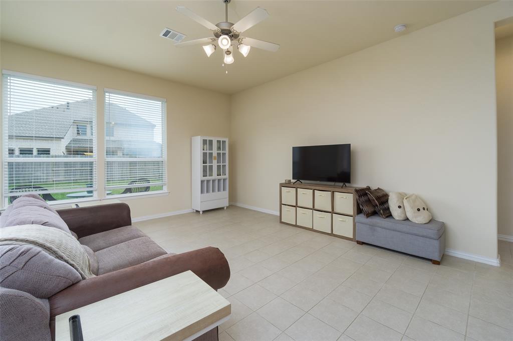 Living room space with huge window overlooking the back yard