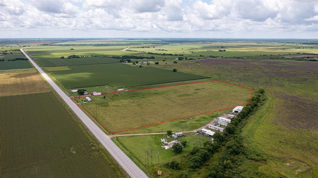 Awesome opportunity here with a nice 20 acre tract of land off State Highway 60 between Wharton and Bay City and it already has an aerobic septic system, water well and is fenced for cattle.   This beautiful property has NO Restrictions and can be whatever you want it to be, build your dream home with land, commercial to build that convenience store, truck stop, RV Park or do all of it!    There is a mobile home on the property that is NOT part of the sale but if you want it with the purchase of the land seller will sign it over free.