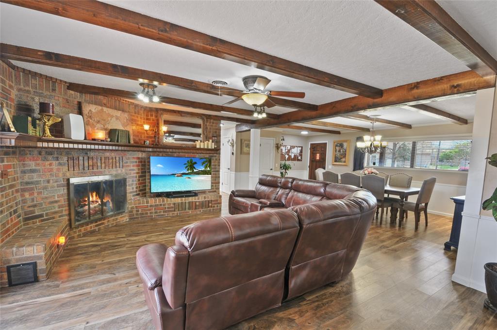 View of the dining and living areas from the modern updated kitchen