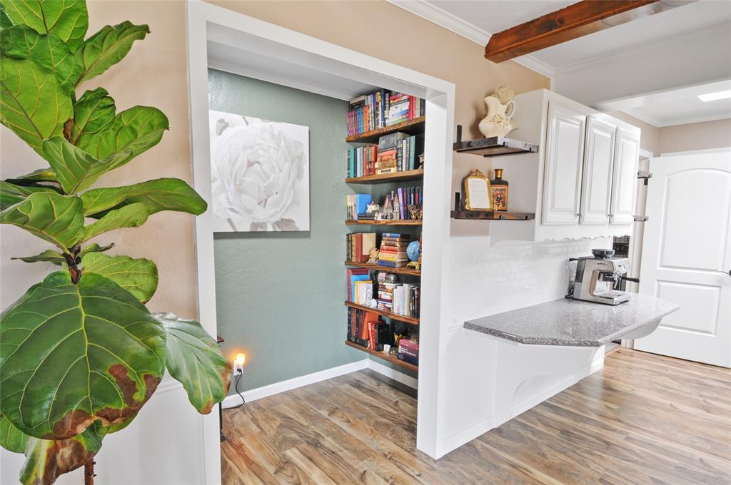 A small library/reading room is handy off the kitchen and living area