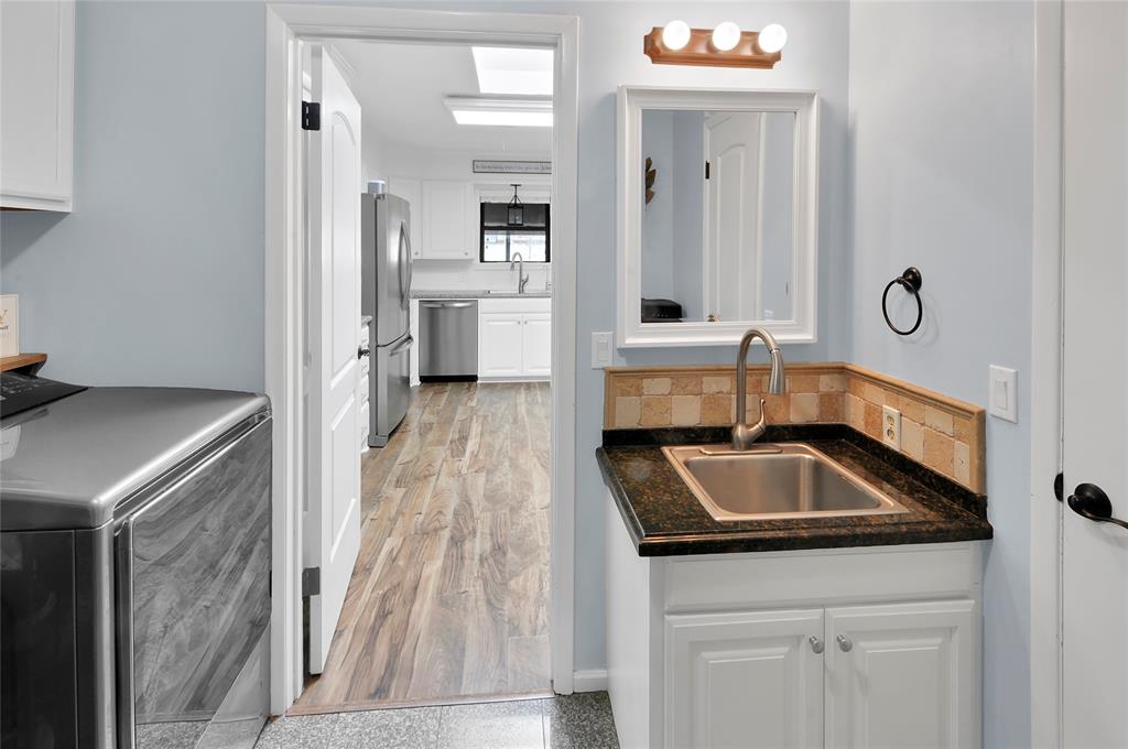 Deep stainless steel sink in the laundry room