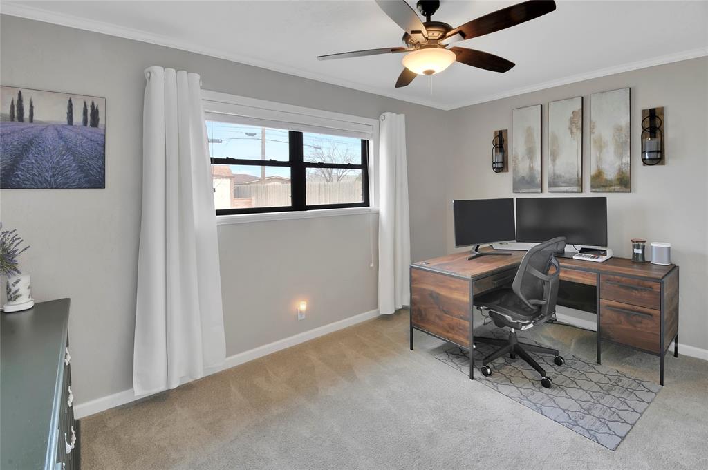 Bedroom 3 has great natural light, a lighted ceiling fan, and is currently doubling as a spacious and quiet home office