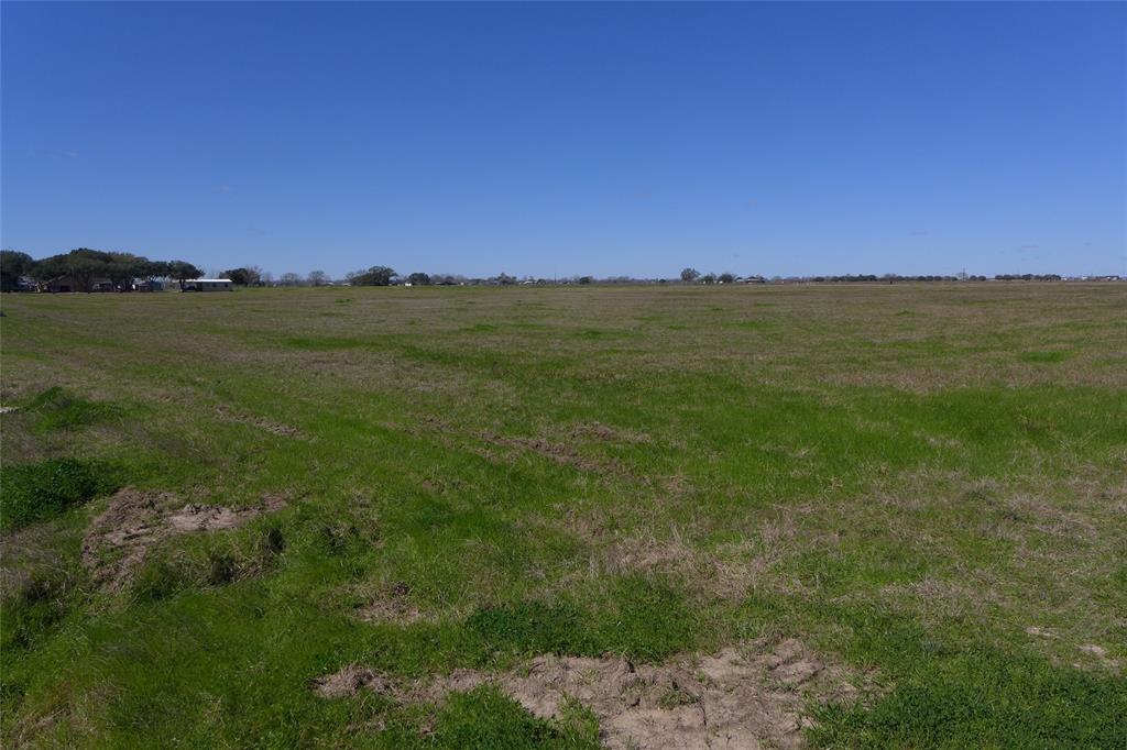Prime location on FM 1952 & Polak Rd- approx. 26 acres of cleared land & currently ag exempt for hay. Survey indicates about 957 ft along FM 1952 and 1588 ft along Polak Rd. Quick access to Rosenberg, Hwy 59, Simonton and Fulshear.  Brazos High School is 3 miles straight drive down Polak Rd.  This could be a potential residential development.  There is a drainage ditch across the back that is maintained by the county.  Seminole pipeline easement running Northwest. Still plenty of land to build on.  Seller to retain all owned minerals, please do not walk the property with out an appointment.