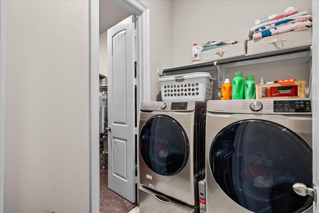 Unique primary closet design passes through to the laundry room