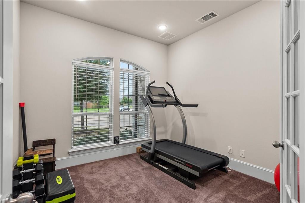 Laundry room conveniently located off the primary closet, and also accessible from the opposite side