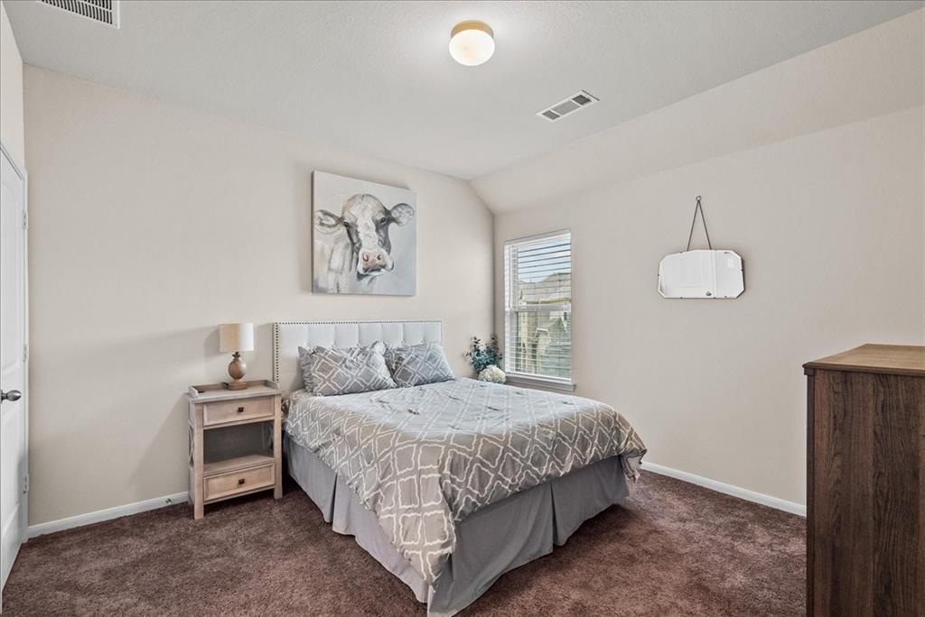 Bedroom 2, located upstairs to the left, faces the front of the house