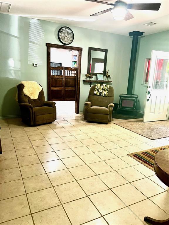 The living room is huge and has a wood burning fireplace in the corner.