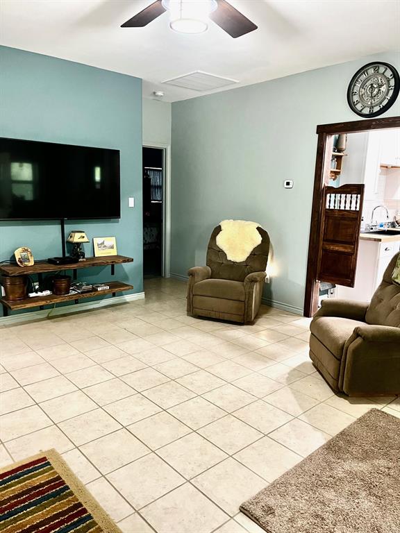 The living room is huge and has a wood burning fireplace in the corner.