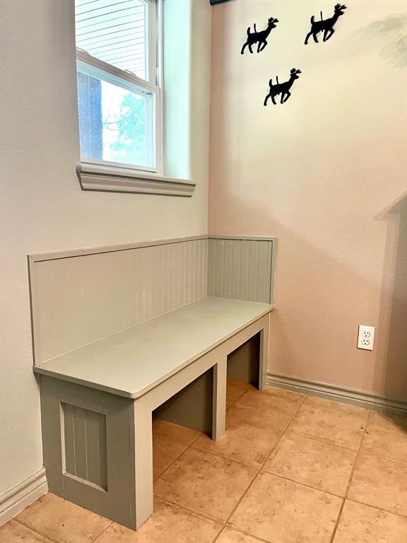 The front door opens into a formal living room.