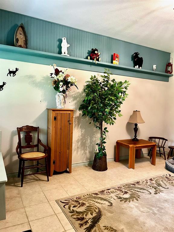 The front door opens into a formal living room.