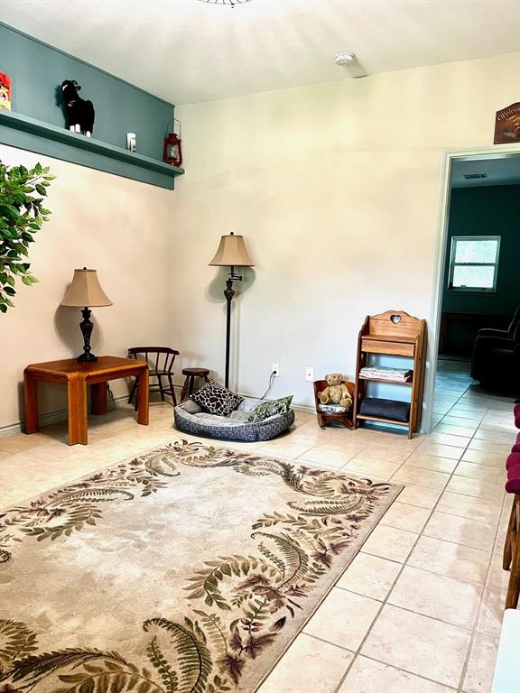 The front door opens into a formal living room.