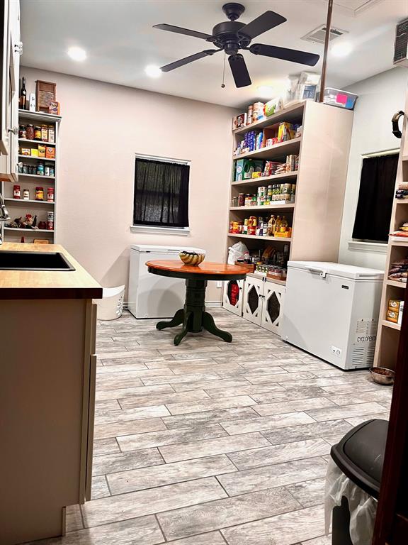 This flex room has so many possibilities. It is currently used as a laundry room and extra pantry space.